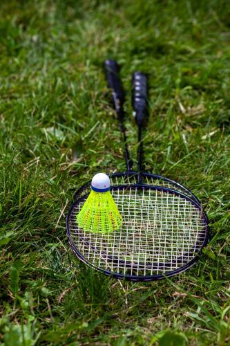 two tennis rackets sitting on the grass at Maison Stukely in St-Etienne de Bolton