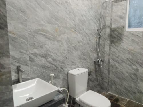 Ein Badezimmer in der Unterkunft Minu Homestay & Villa