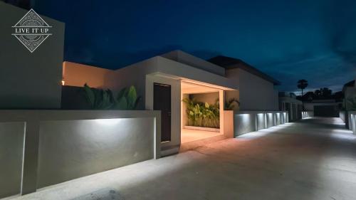 a house with a door in the night at Santi Tara Villas in Amphoe Koh Samui