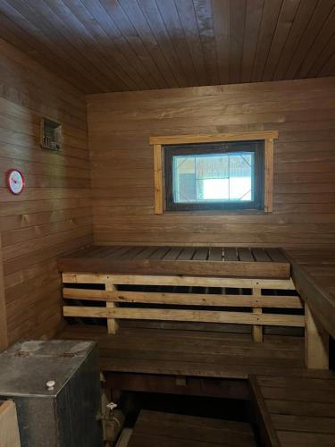 a room with a sauna with a window at Pangamäe puhkemaja in Lokuta