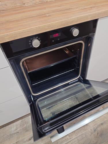 a toaster oven sitting on top of a counter at Appartement T2 moderne 2 à 4 personnes in Lucciana