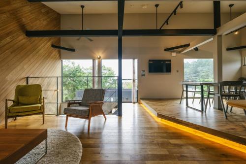 a living room with chairs and a table at 青山 loop in Yamanakako