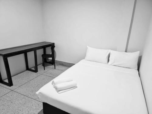 Ένα ή περισσότερα κρεβάτια σε δωμάτιο στο Mitr inn Khaosan มิตร อินน์ ถนนข้าวสาร 2