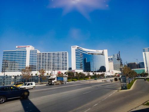 a city street with cars driving on a highway with buildings at Amazing Appartement au centre ville en face HILTON & la Gare Train de TGV in Tangier