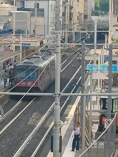 a train on the tracks at a train station at Nice room with private bathroom in Ercolano