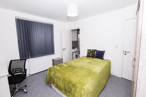 a bedroom with a bed and a desk and a chair at Stylish Ensuite Rooms, Middlesbrough TS5 in Middlesbrough