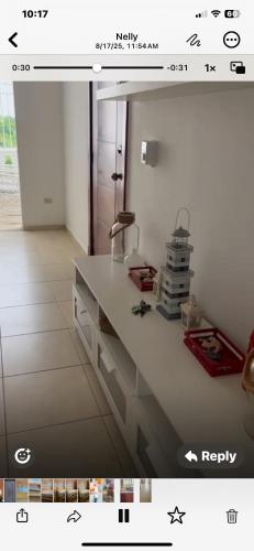a screenshot of a kitchen with a white counter top at Apartamento en Gribi in Juan Dolio