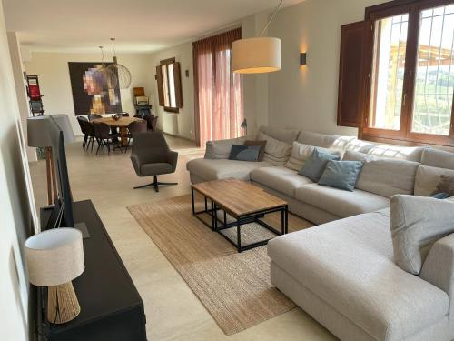 a living room with a couch and a table at Dolce Villa Toscana - private pool, air conditioning in San Gimignano