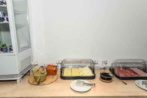 a kitchen with two trays of food on a counter at Johann Strauss Hotel in Bucharest