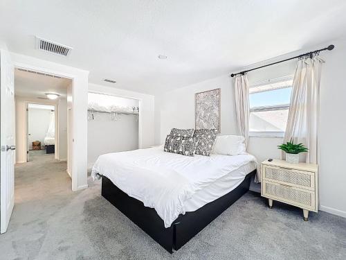 a bedroom with a large bed and a window at New Beautiful Seminole Pool Home in Seminole