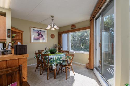 a kitchen and dining room with a table and chairs at Bridges 19 condo in Sugarbush Village