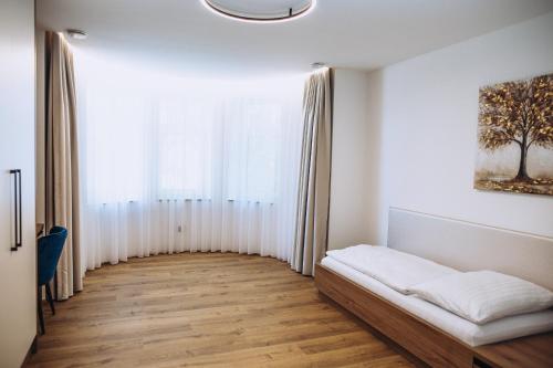 a living room with a couch and a window at Apartmány Orlí in Hranice
