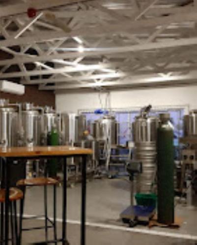 a room with a bunch of tanks in a brewery at Seaside Escape in Pearly Beach
