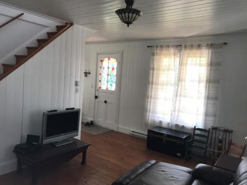 Телевизор и/или развлекательный центр в Chalet L'Ancrage