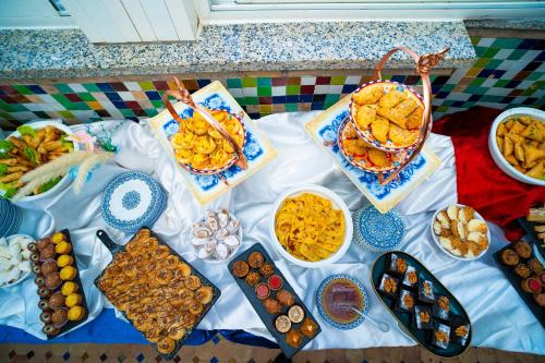 a table with many different types of food on it at Palais Zahia Hotel & Spa in Tangier