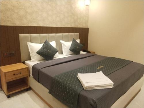Postel nebo postele na pokoji v ubytování Hotel Imperia Grand