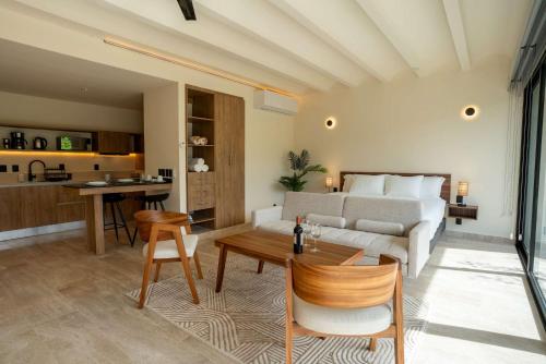 a living room with a couch and a table at Modern Confort Perfect for All Travelers in Cancún