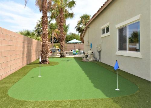 a miniature golf course in the yard of a house at Mt San Jacinto View Home in Palm Springs