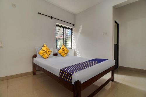 Postel nebo postele na pokoji v ubytování Hotel O U & I LIVINGS