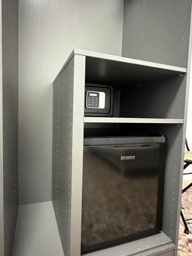 a microwave oven sitting inside of a refrigerator at Domus Park Avenue in Rome
