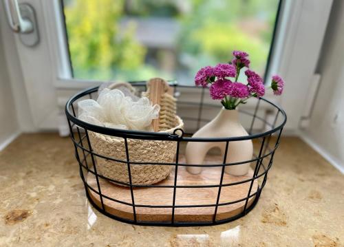 a basket filled with shoes and flowers on a counter at Seeidyll an der Wublitz in Werder