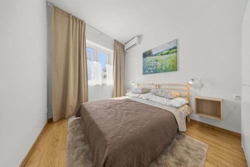 Postel nebo postele na pokoji v ubytování Grey Luxe Residence