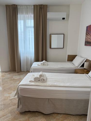 Ένα ή περισσότερα κρεβάτια σε δωμάτιο στο Melannie's Apartment 2