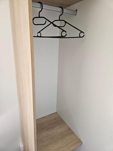 a stairwell in a room with a shelf at Mobilhomme Privilège in Biscarrosse