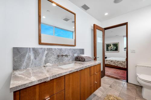 a bathroom with a sink and a toilet at ocean front beach house in Oxnard
