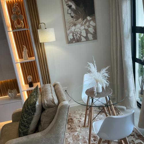 a living room with a couch and a table at DRJ Luxe Table view in Table View