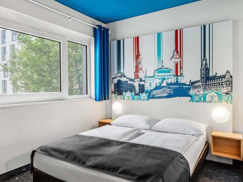 a bedroom with a bed and a window at B&B Hotel Hamburg City-Ost in Hamburg