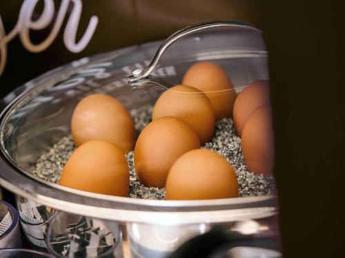 a bunch of eggs in a glass container at B&B HOTEL Willich in Willich