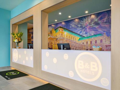 an office with a wall mural of a building at B&B Hotel Wien-Hbf in Vienna