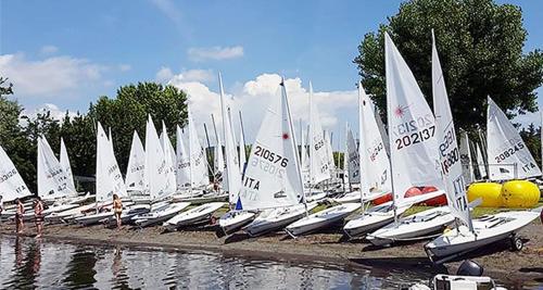 a bunch of sailboats are lined up in a harbor at Peter giardino e casa sul lago in Bracciano
