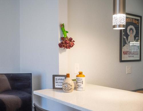 a room with a counter with two bottles on it at Home With Sunset Patio, Fenced Backyard, And Quick Access To Denver - Gray Street in Arvada