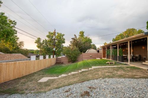 a backyard of a home with a wooden fence at Home With Sunset Patio, Fenced Backyard, And Quick Access To Denver - Gray Street in Arvada