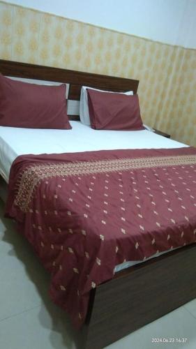 Cama o camas de una habitación en Sunrise Palace Guest House
