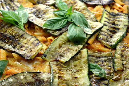 a close up of a pizza with vegetables on it at Enny Camere in Alcamo