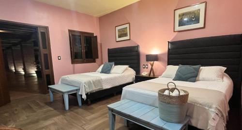 Ένα ή περισσότερα κρεβάτια σε δωμάτιο στο Hotel Siglo 17