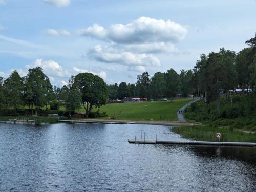 a lake with a dock in the middle of it at 4 star holiday home in MALMKÖPING-By Traum in Malmköping