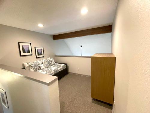 a living room with a couch and a table at Wedgewood Lodge in Breckenridge