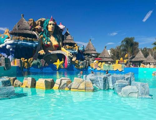 a woman in the water at a water park at Departamento amplio en el centro de Ixmiquilpan "Casa de las Aguas" in Ixmiquilpan