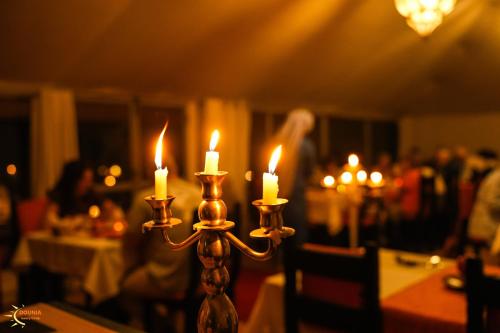 a group of candles sitting on top of a table at Dounia Luxury Camp in Merzouga