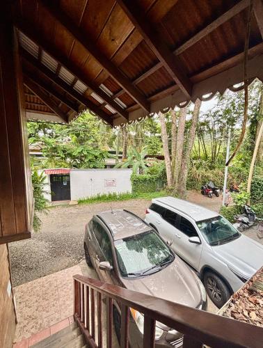 a car parked on a porch next to a house at Kalawala in Puerto Viejo