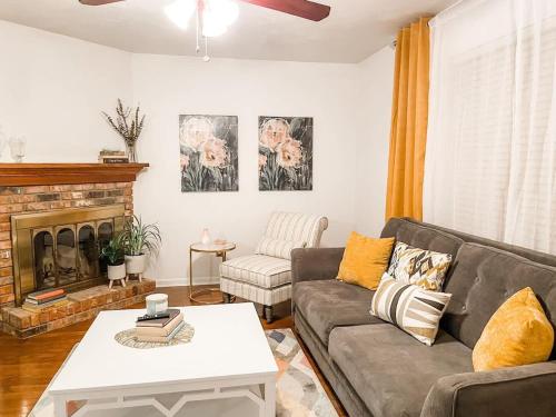 a living room with a couch and a fireplace at Tally Town Gem 2bdr 2 Ba townhome in Perkins