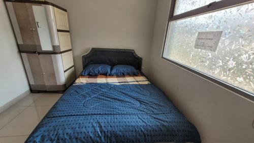 Postel nebo postele na pokoji v ubytování Rai Guest House