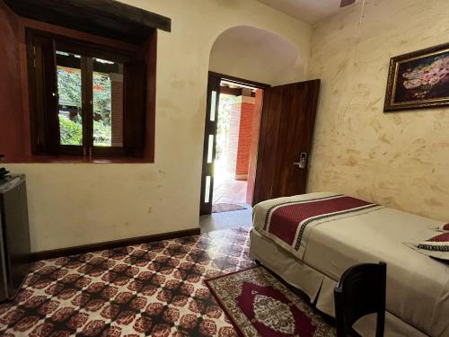 Ένα ή περισσότερα κρεβάτια σε δωμάτιο στο Hotel Siglo 17