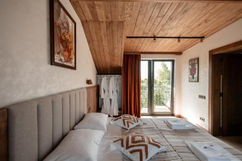 a bedroom with two beds in front of a window at Dzvin in Slavske