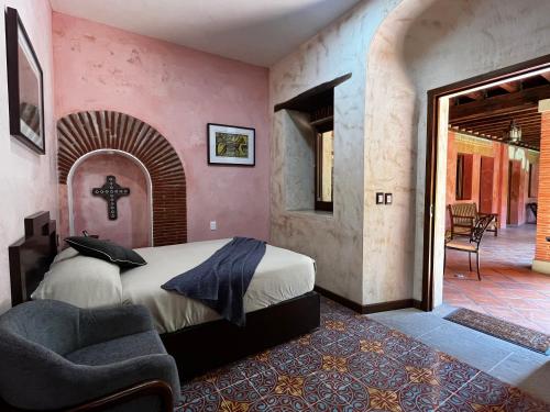 Ένα ή περισσότερα κρεβάτια σε δωμάτιο στο Hotel Siglo 17