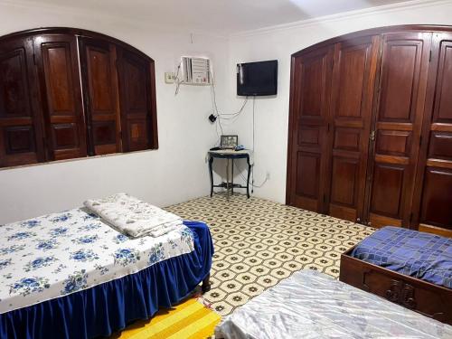 Ένα ή περισσότερα κρεβάτια σε δωμάτιο στο COP 30 Casa com 600 mt 5 suítes e piscina